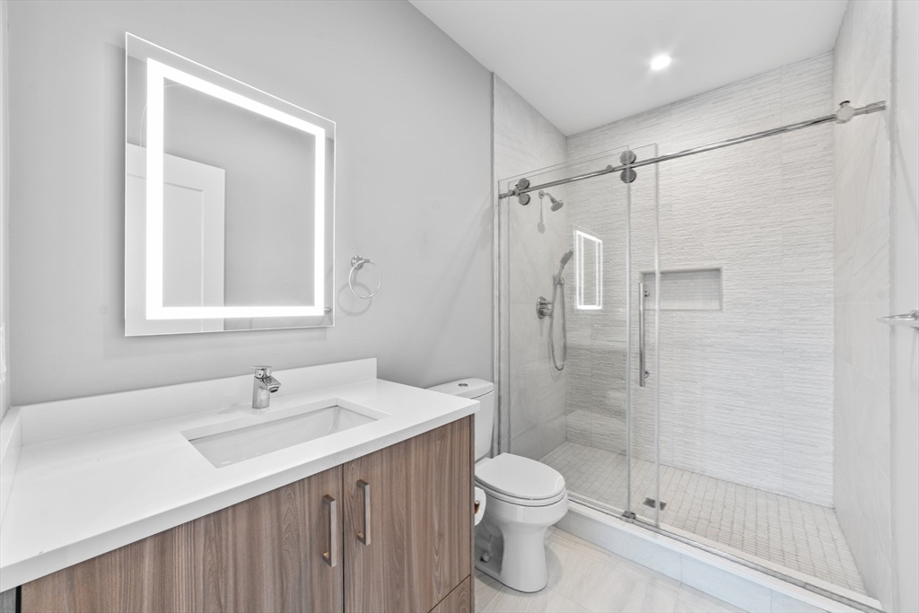 19 Boulder Road Newton, MA 02459 - Photo 28 of 42 a bathroom with a sink toilet and shower