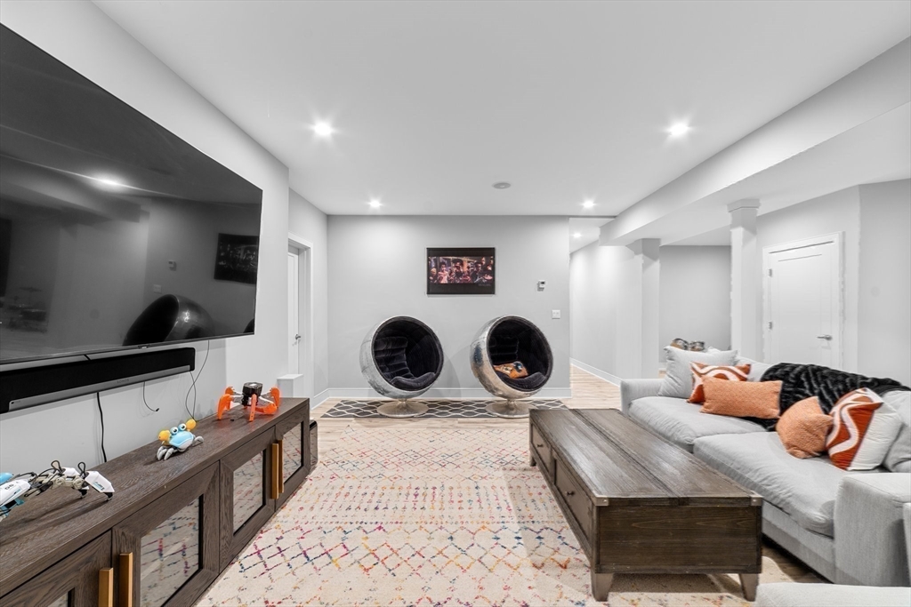 19 Boulder Road Newton, MA 02459 - Photo 29 of 42 a living room with furniture a rug and white walls