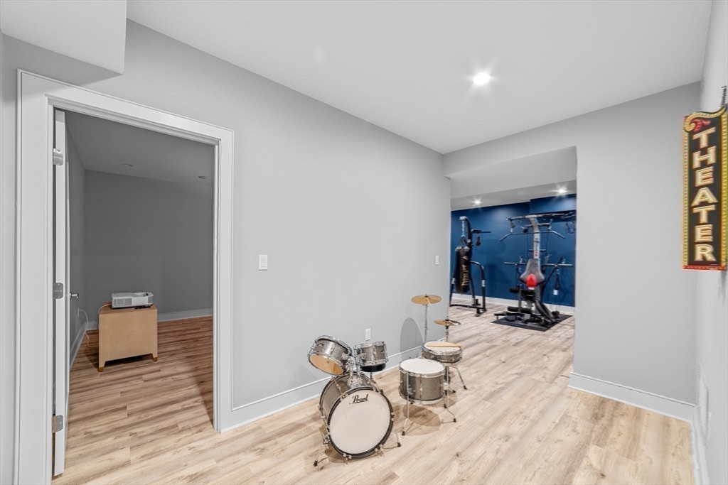 19 Boulder Road Newton, MA 02459 - Photo 34 of 42 a room with gym equipment and view of living room