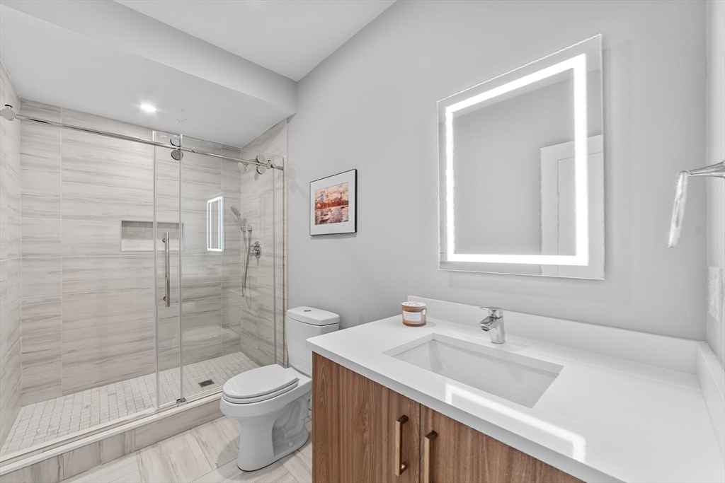 19 Boulder Road Newton, MA 02459 - Photo 35 of 42 a bathroom with a sink toilet and shower