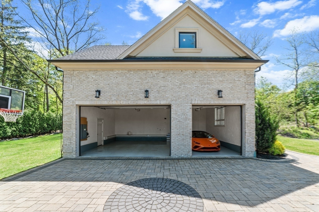 19 Boulder Road Newton, MA 02459 - Photo 38 of 42 a front view of house with yard and trees in the background
