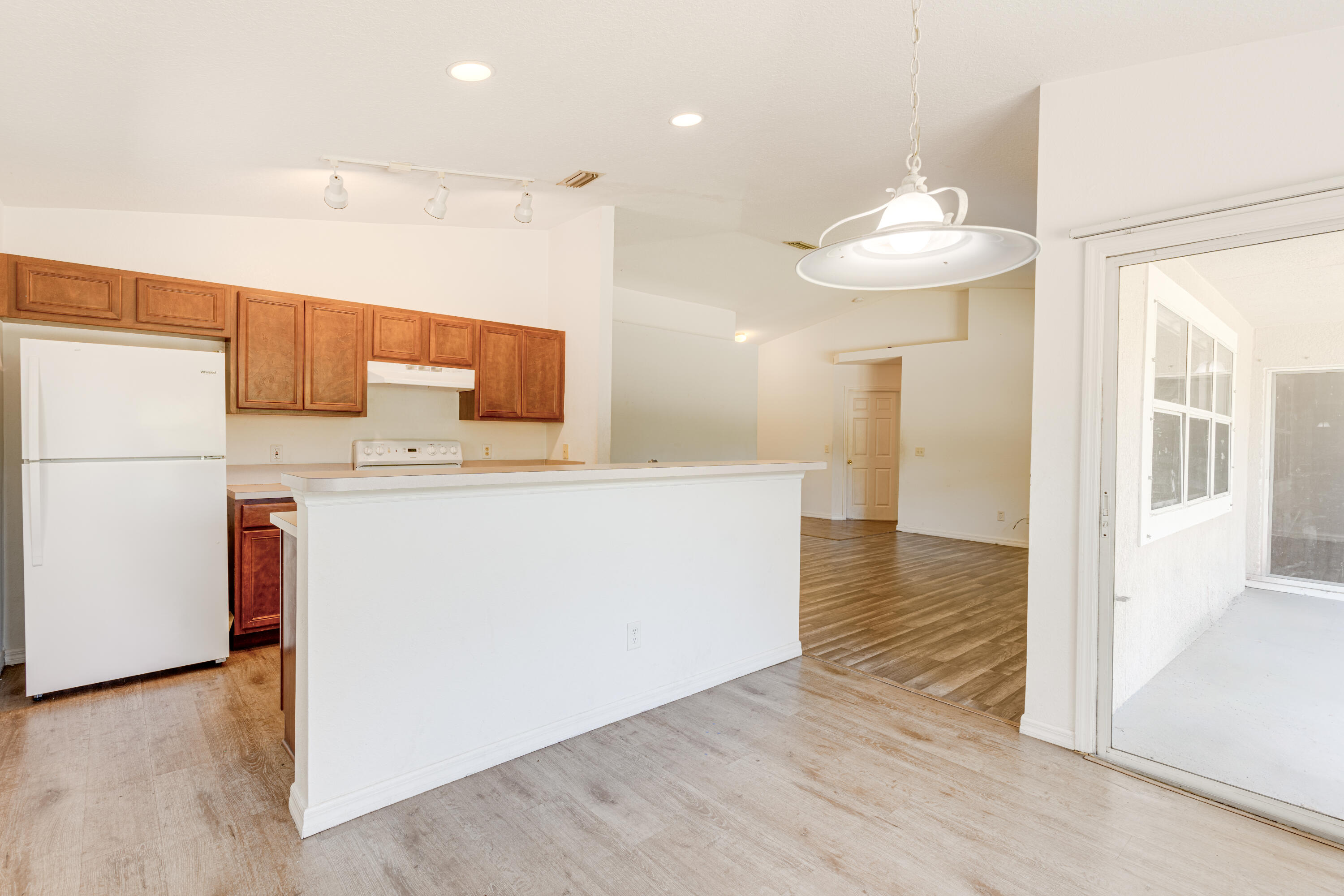 500 Topeka Road Southwest Palm Bay, FL 32908 - Photo 7 of 12 a view of a kitchen cabinets and wooden floor