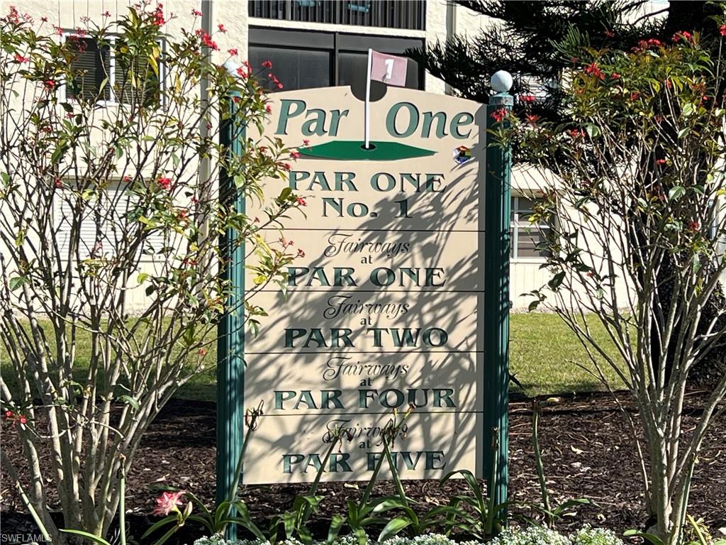 4293 27th Court Southwest, Unit 203 Naples, FL 34116 - Photo 24 of 26 a sign that is on a pole