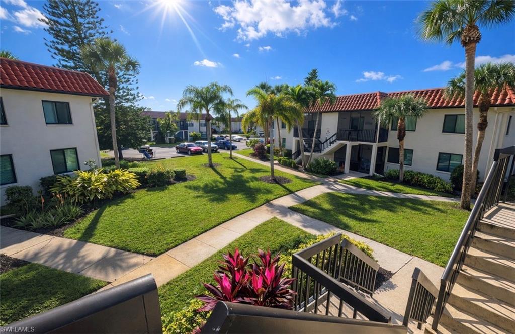 4293 27th Court Southwest, Unit 203 Naples, FL 34116 - Photo 4 of 22 a view of a backyard with sitting area
