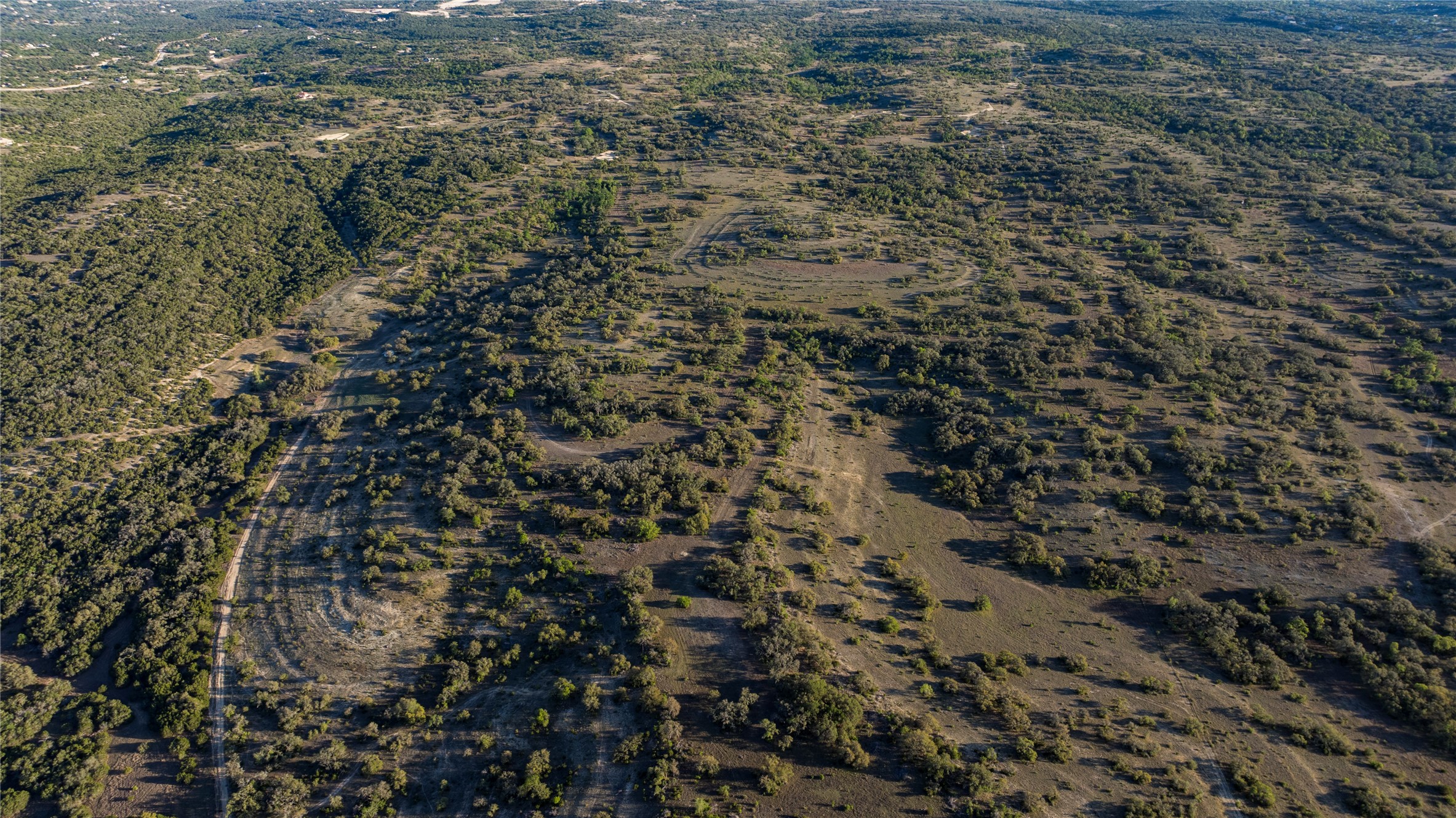 157 Chick Ranch Road Blanco, TX 78606 - Photo 29 of 34 a view of a city with lush green forest