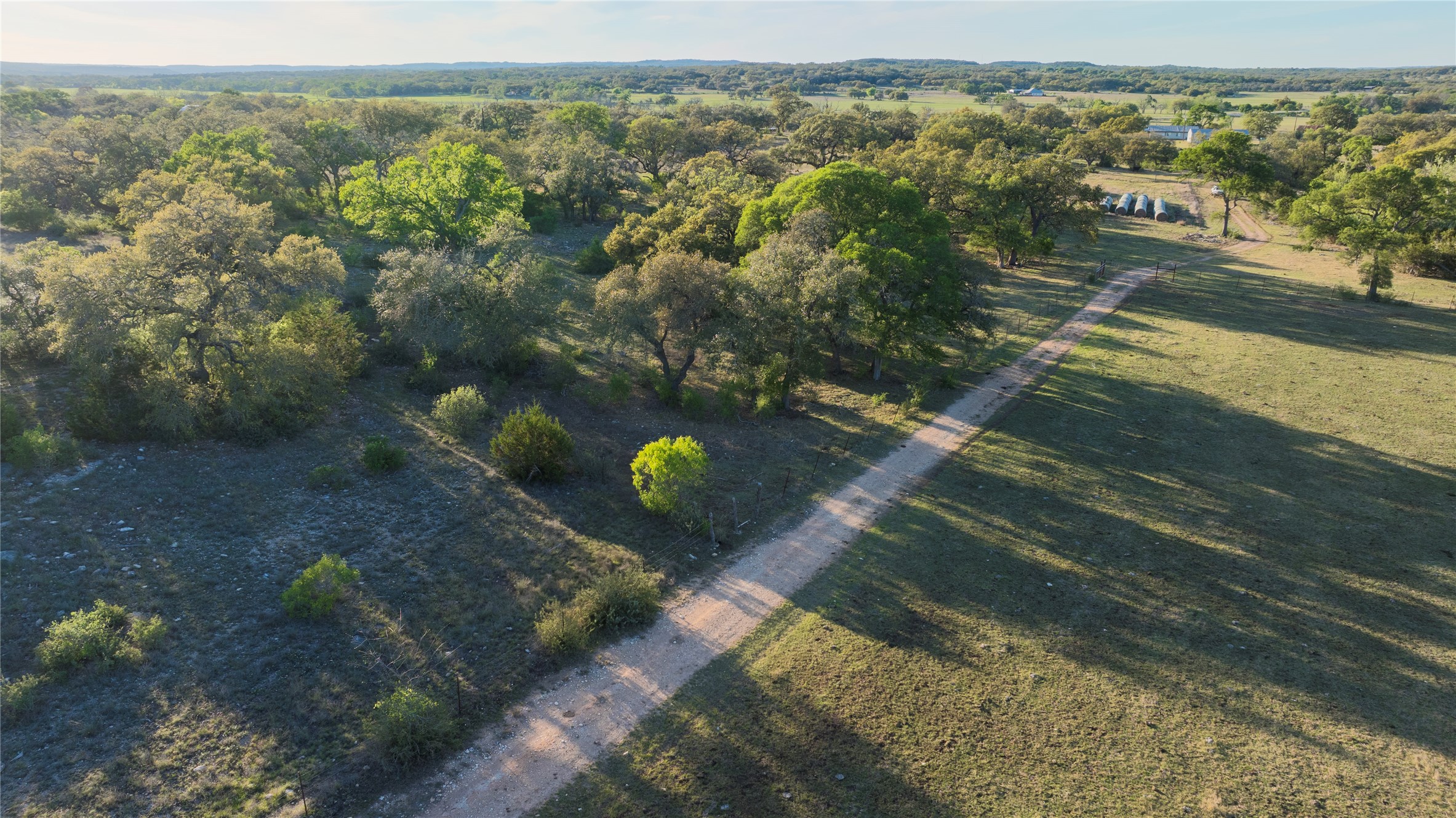 157 Chick Ranch Road Blanco, TX 78606 - Photo 9 of 34 a view of a lake with a mountain in the background