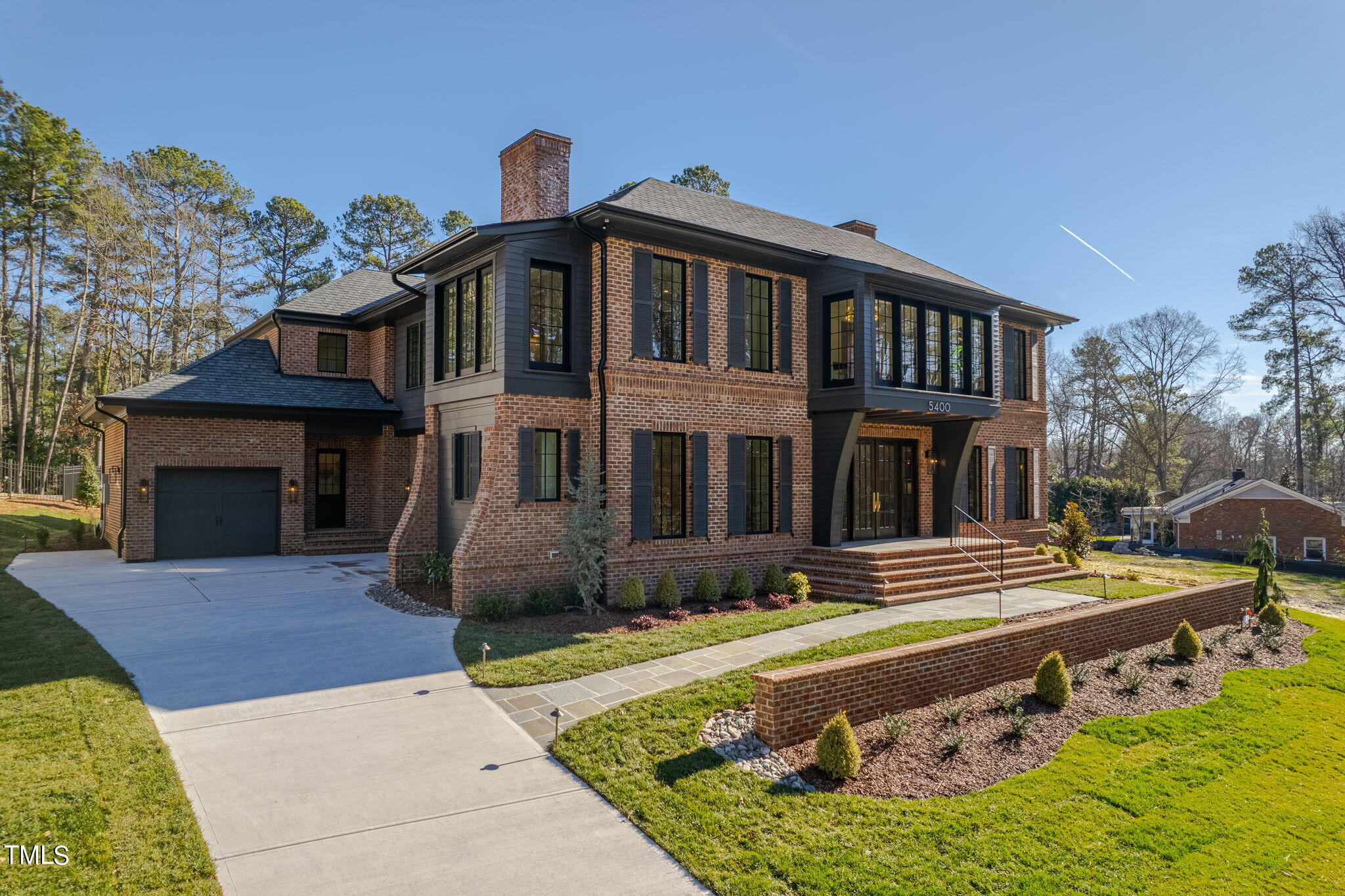 5400 Alpine Drive Raleigh, NC 27609 - Photo 1 of 70 a front view of a house with garden