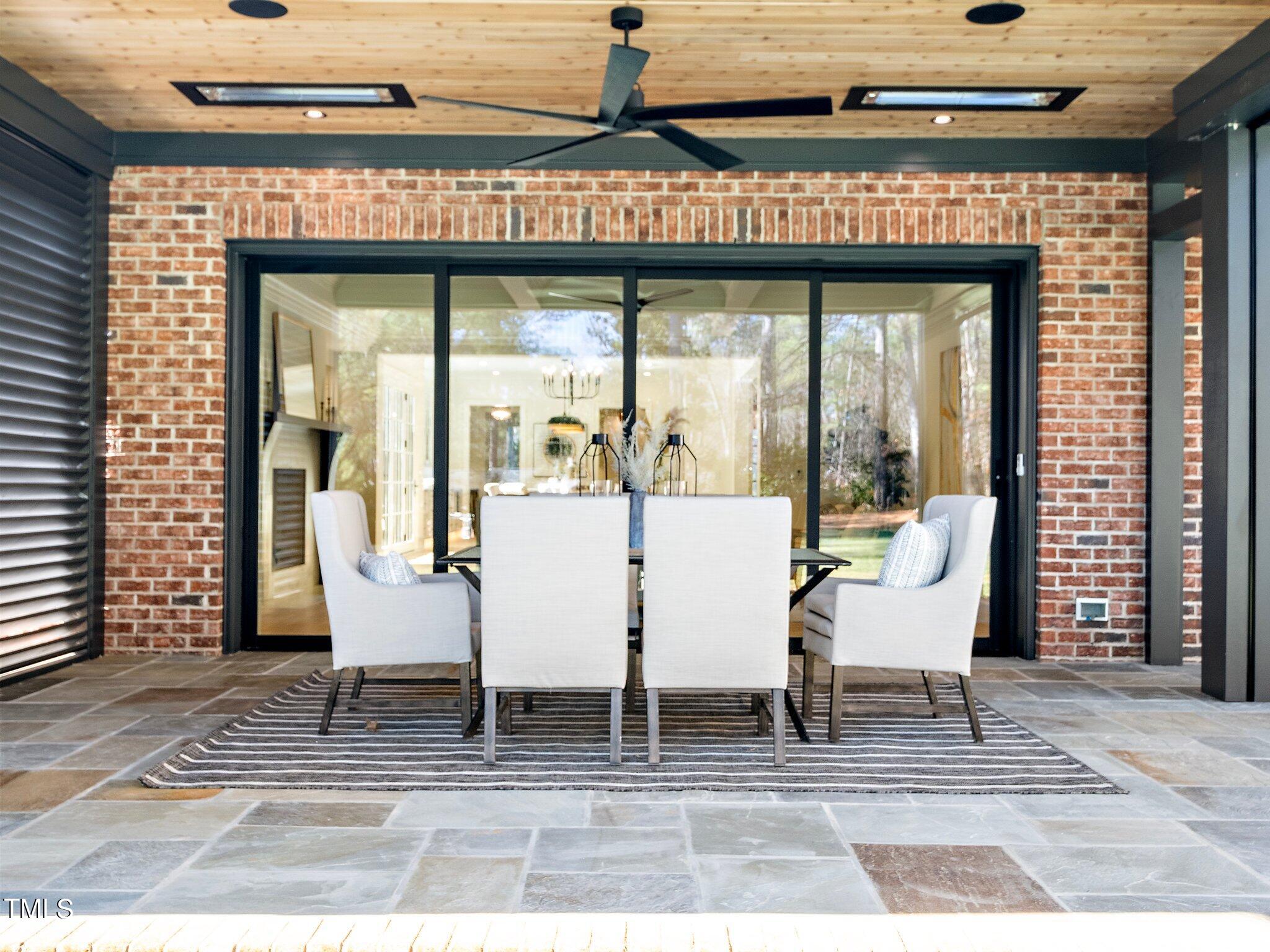 5400 Alpine Drive Raleigh, NC 27609 - Photo 56 of 70 a view of a patio with table and chairs and potted plants