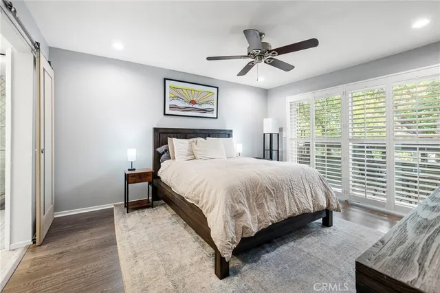 a bed room with a bed and a window