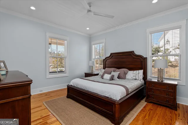 a bedroom with two beds and a chandelier