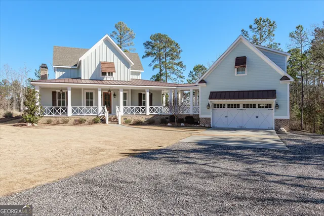 a view of a balcony with wooden floor and furniture