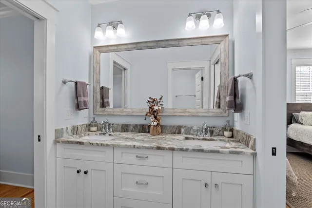 a bathroom with a shower a toilet and a sink