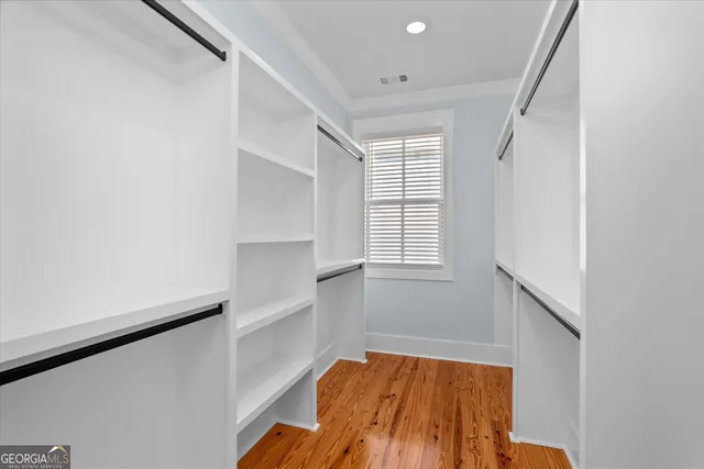 a view of a patio with table and chairs potted plants with wooden floor