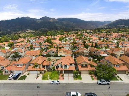 an aerial view of residential house and sandy dunes