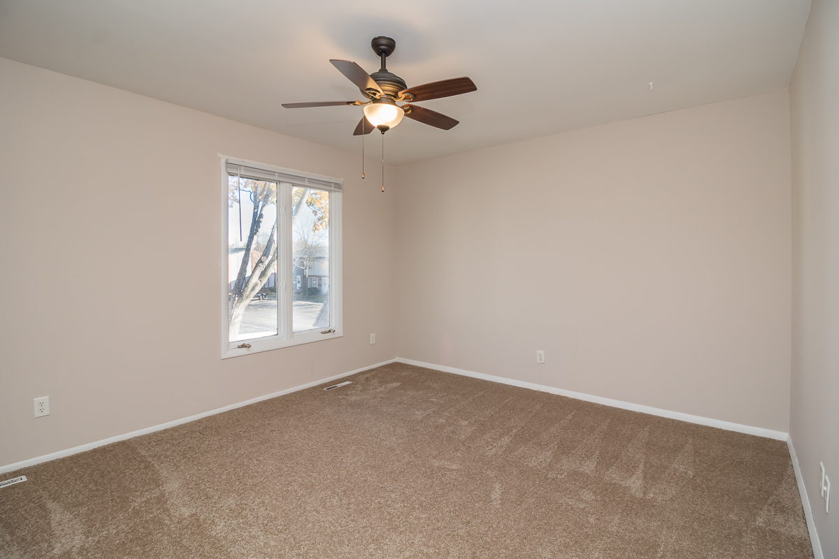 11 Cypress Square Place Elgin, IL 60123 - Photo 12 of 21 a view of a livingroom with a ceiling fan and window