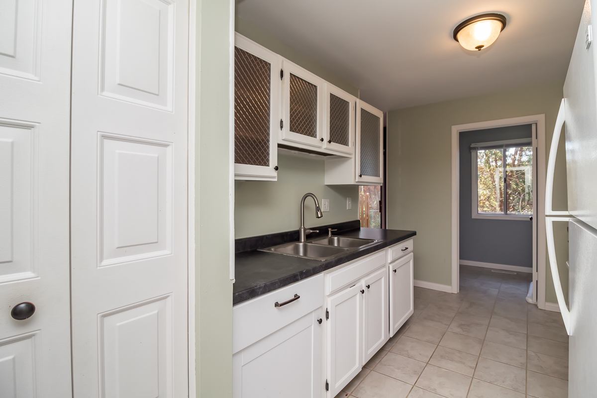 11 Cypress Square Place Elgin, IL 60123 - Photo 4 of 21 a kitchen with granite countertop white cabinets and stainless steel appliances