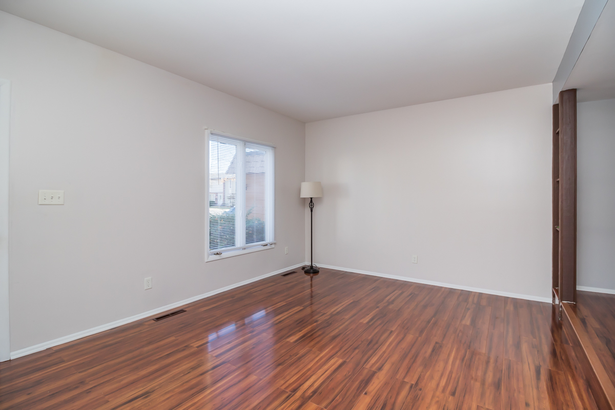 11 Cypress Square Place Elgin, IL 60123 - Photo 6 of 21 a view of an empty room with wooden floor and a window