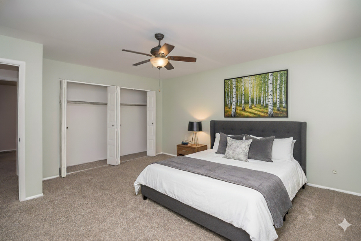 11 Cypress Square Place Elgin, IL 60123 - Photo 9 of 21 a bedroom with a bed and a chandelier
