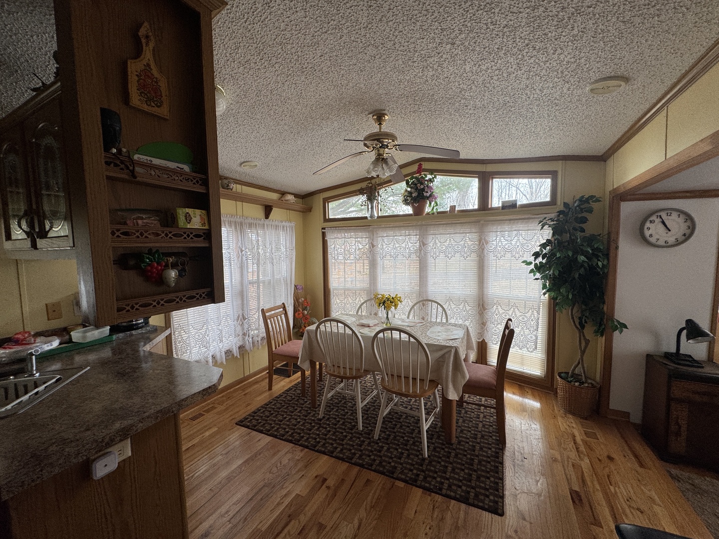 21-211 Woodhaven Lakes Sublette, IL 61367 - Photo 11 of 17 a view of a dining room with furniture and wooden floor