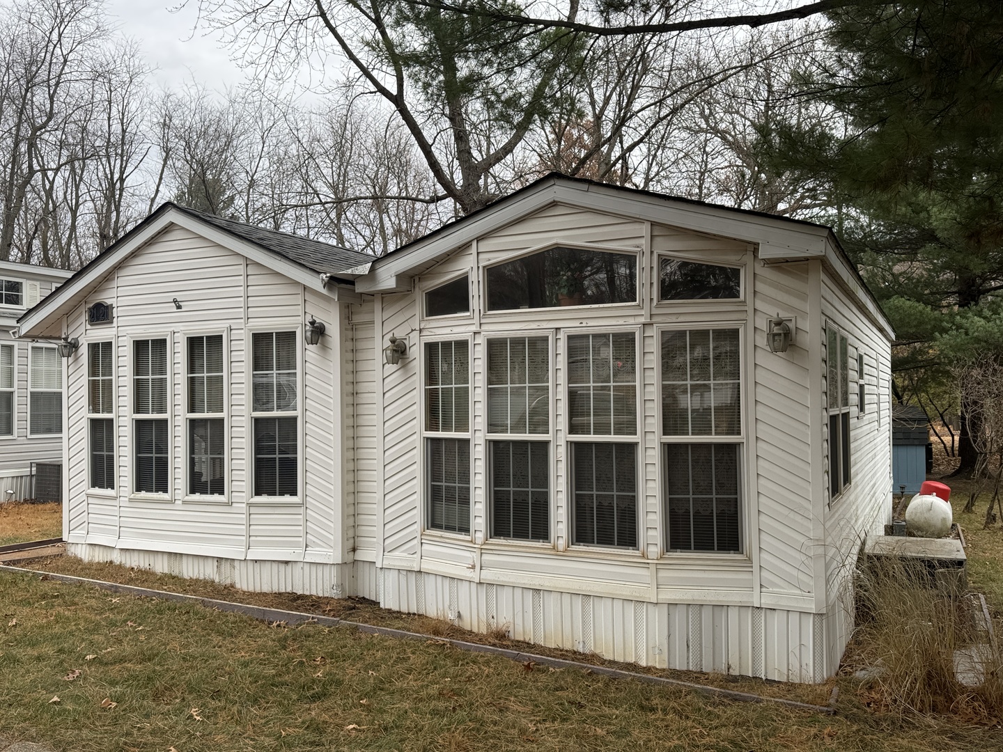 21-211 Woodhaven Lakes Sublette, IL 61367 - Photo 2 of 17 a front view of a house with a yard