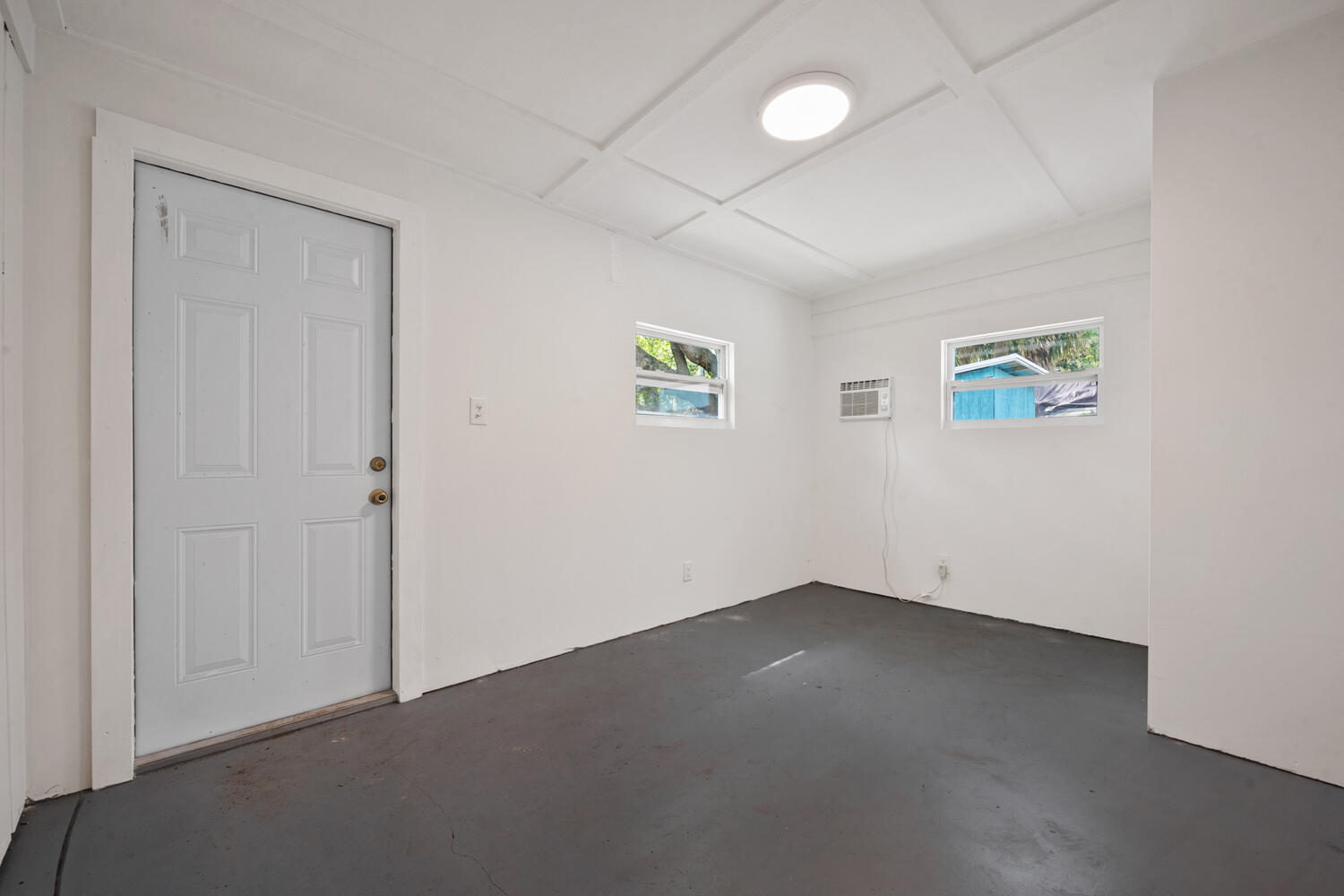 1718 Ridge Road North Palm Beach, FL 33408 - Photo 28 of 39 an empty room with windows