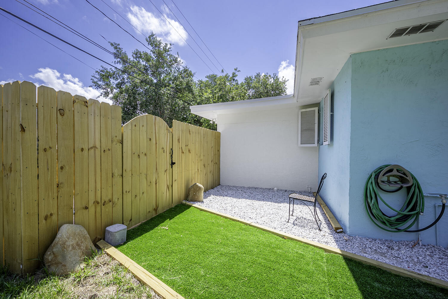 1718 Ridge Road North Palm Beach, FL 33408 - Photo 37 of 39 a view of an entrance with a backyard of the house
