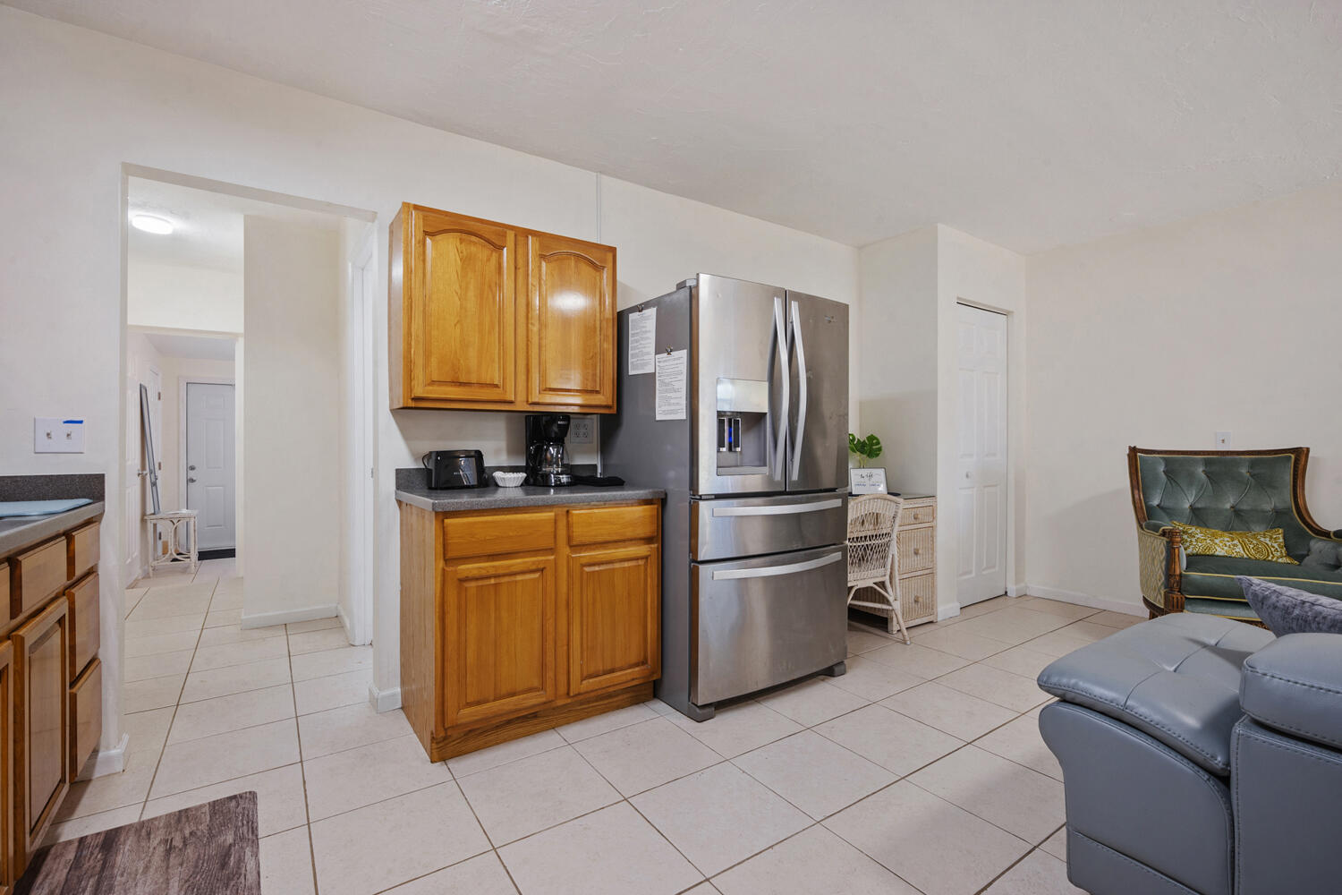 1718 Ridge Road North Palm Beach, FL 33408 - Photo 6 of 39 a kitchen with stainless steel appliances granite countertop a refrigerator and a stove top oven