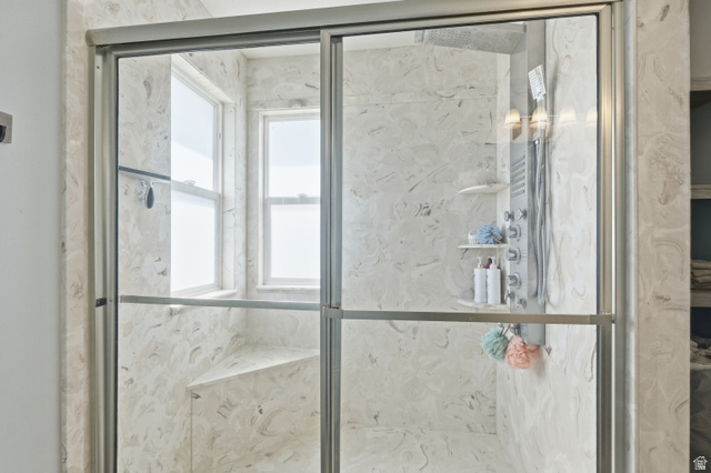860 West 2980th Street South Logan, UT 84321 - Photo 19 of 38 Shower enclosure featuring full-height glass doors and a built-in bench