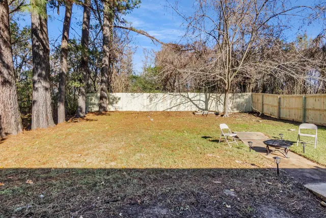 a view of a yard with an outdoor space