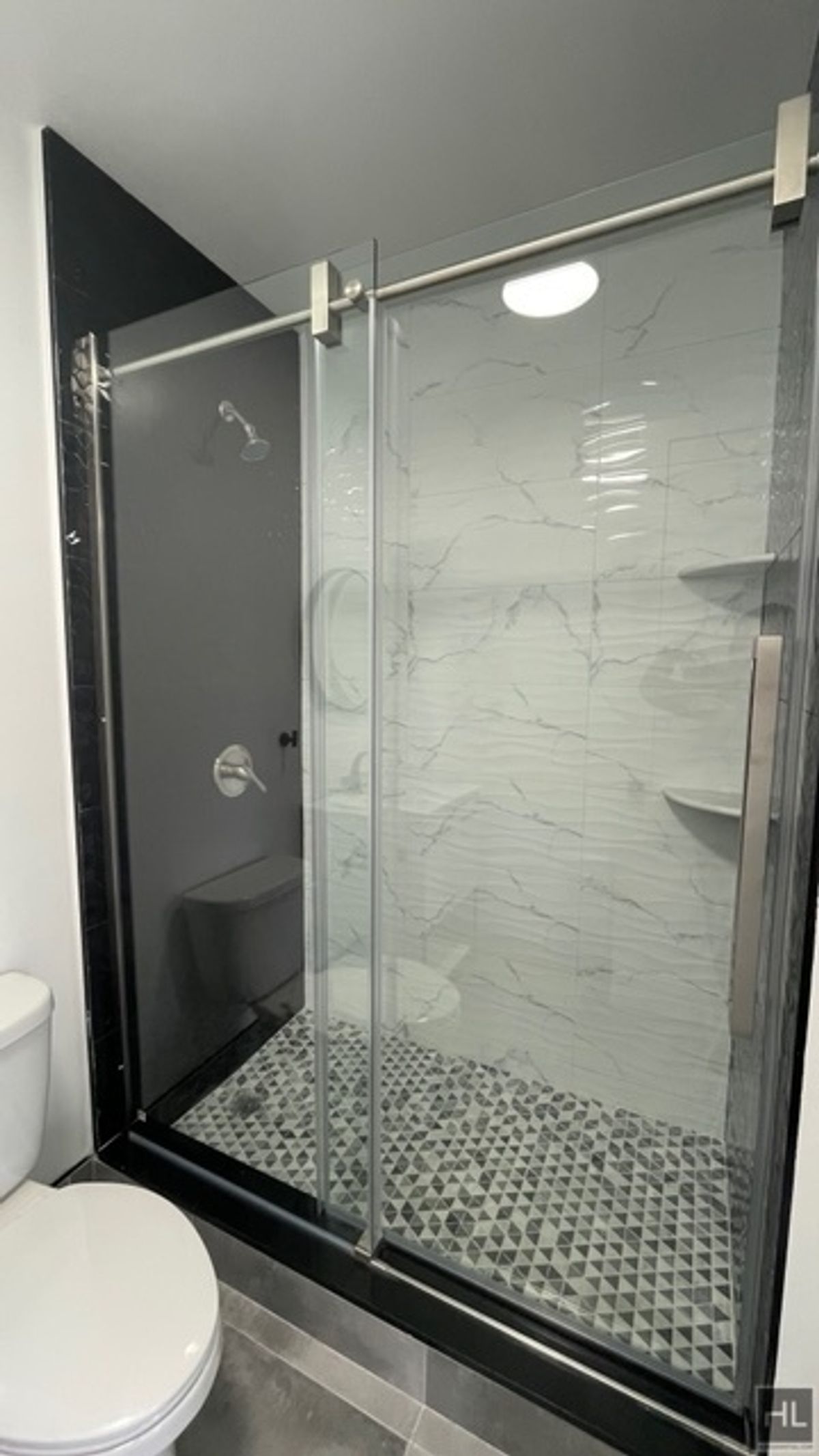 237 Utica Avenue, Unit 2R Brooklyn, NY 11213 - Photo 15 of 34 a bathroom with a shower and a toilet