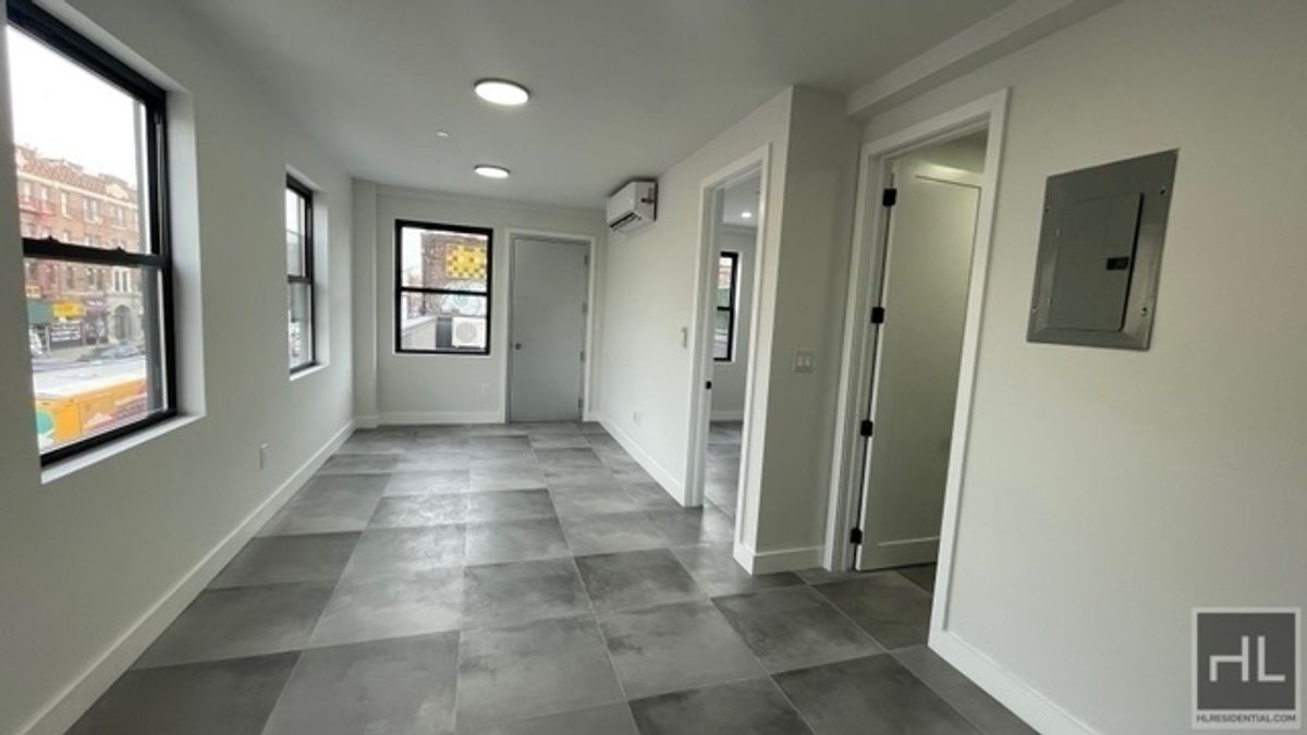 237 Utica Avenue, Unit 2R Brooklyn, NY 11213 - Photo 3 of 34 a view of hallway with windows and chandelier