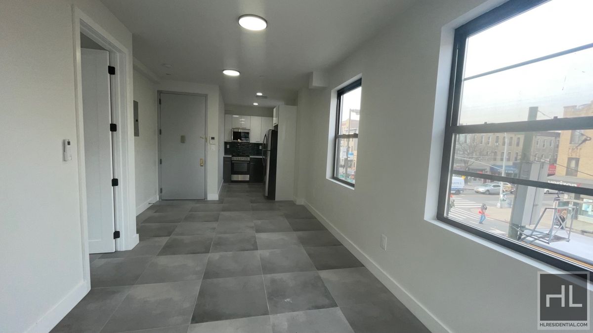 237 Utica Avenue, Unit 2R Brooklyn, NY 11213 - Photo 4 of 34 a view of hallway with windows and chandelier