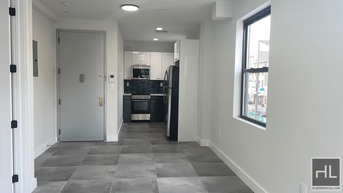 237 Utica Avenue, Unit 2R Brooklyn, NY 11213 - Photo 6 of 34 a view of kitchen with windows and refrigerator
