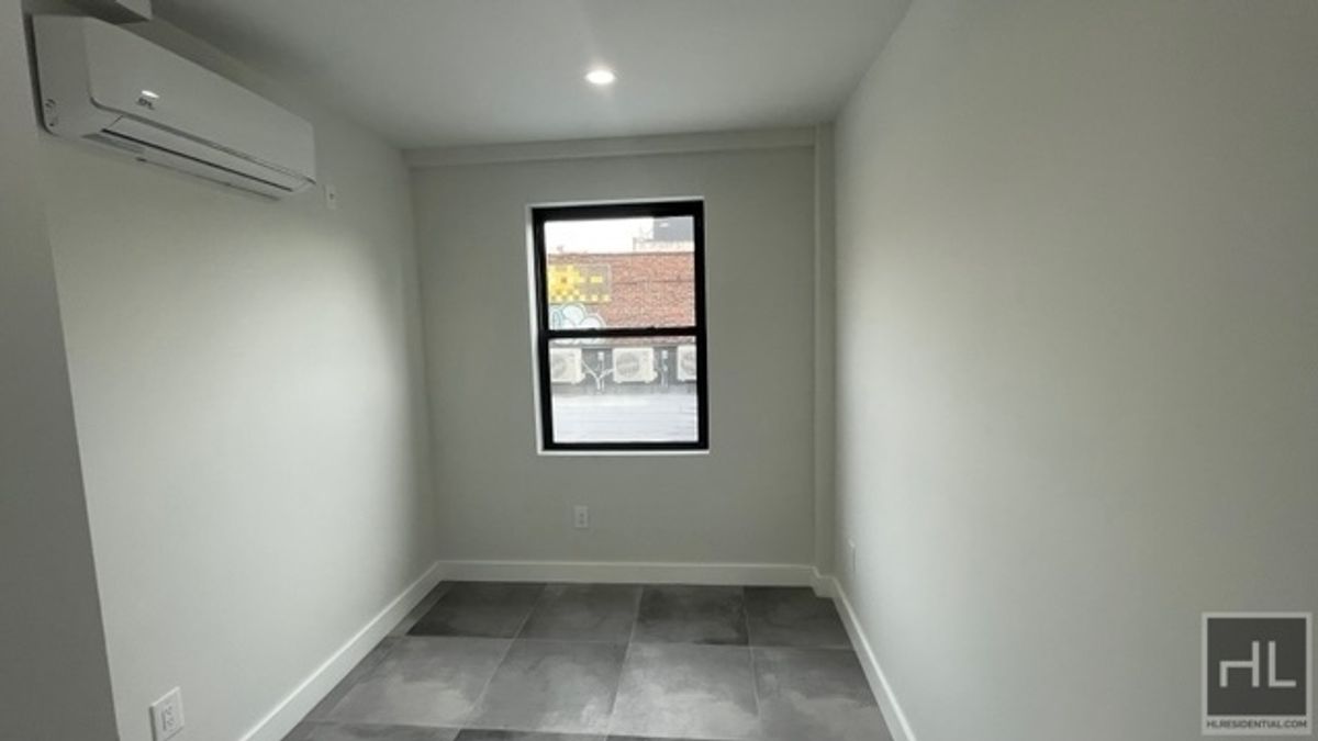 237 Utica Avenue, Unit 2R Brooklyn, NY 11213 - Photo 9 of 34 an empty room with a window