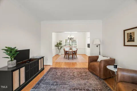 a living room with furniture and a table