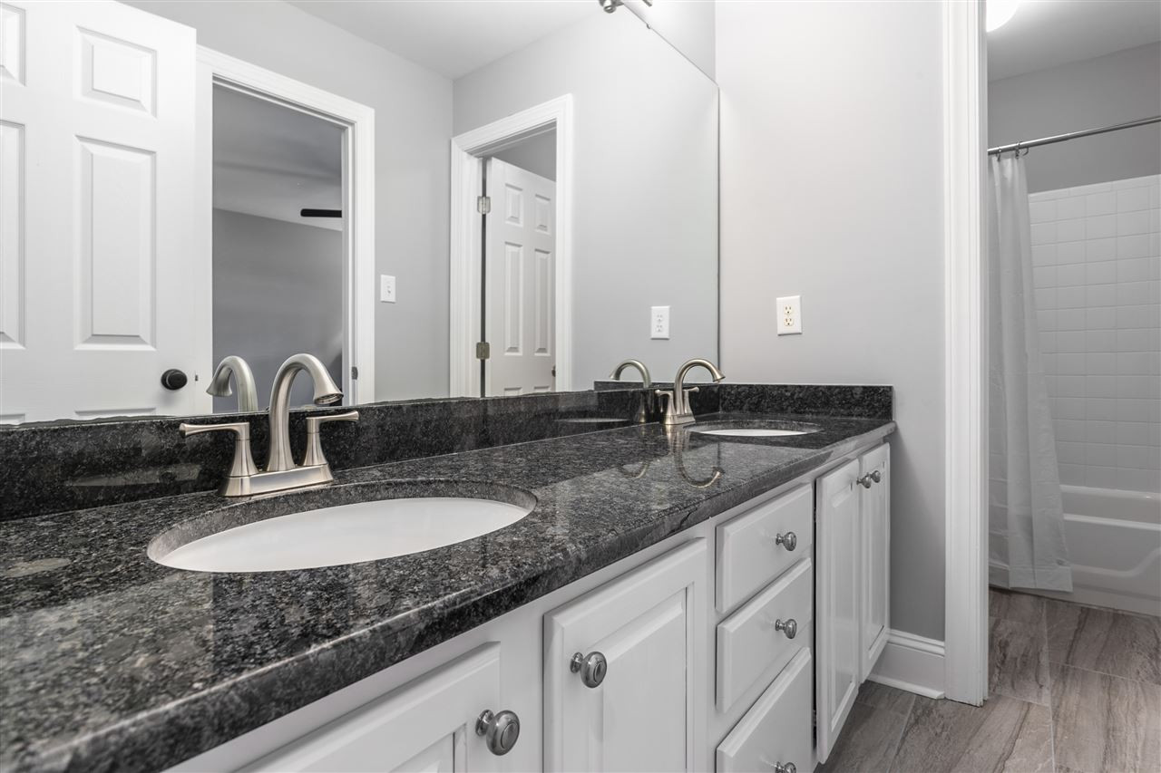 8005 Kukui Court Raleigh, NC 27613 - Photo 14 of 30 Secondary bath upstairs