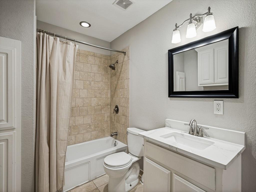 5975 Diamond Spur Frisco, TX 75036 - Photo 30 of 40 a bathroom with a sink toilet a mirror and shower