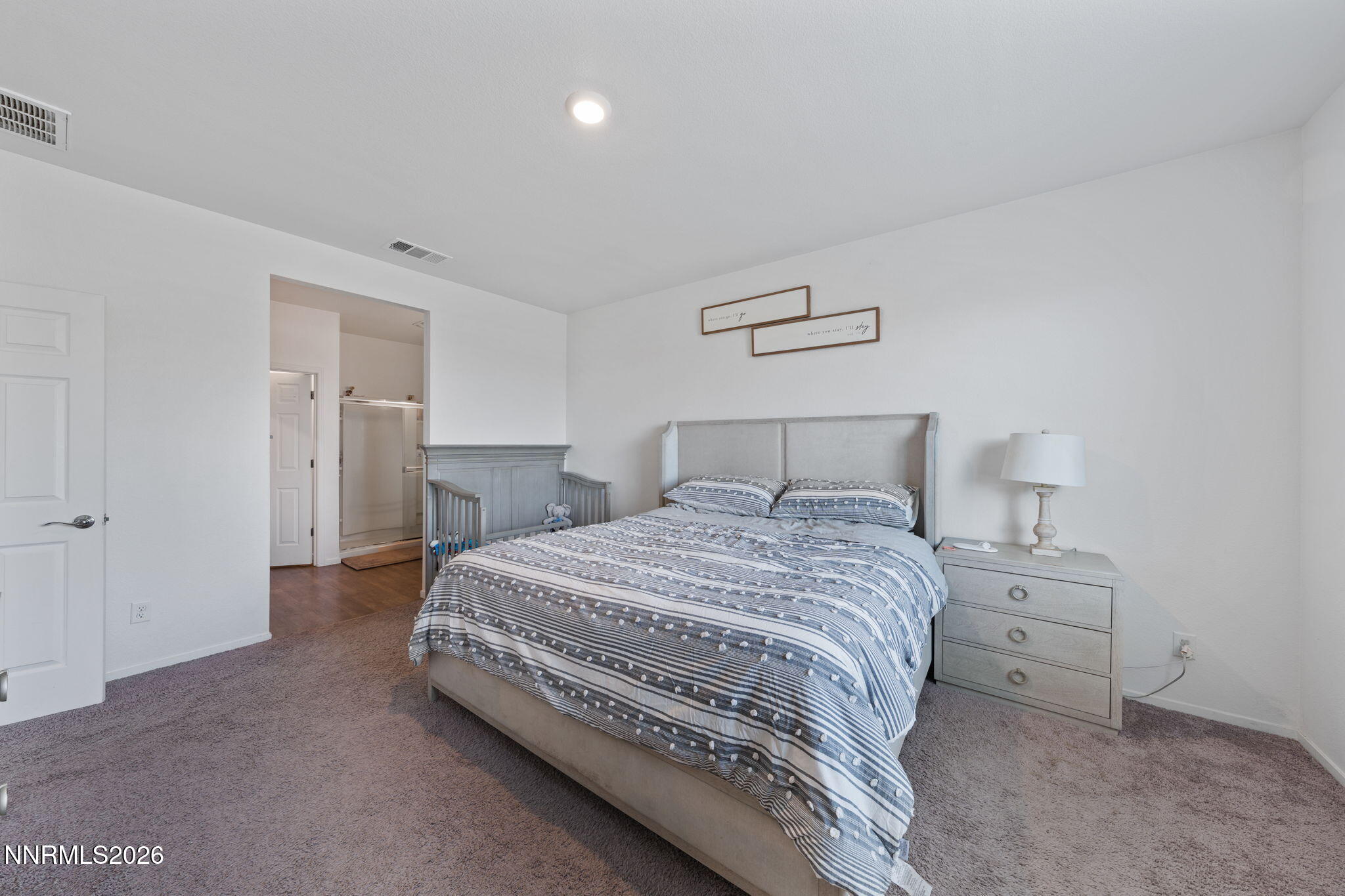 9708 Sea Glass Drive Reno, NV 89506 - Photo 18 of 51 a bedroom with a bed and closet