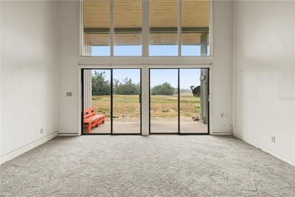 a view of an empty room with a large window