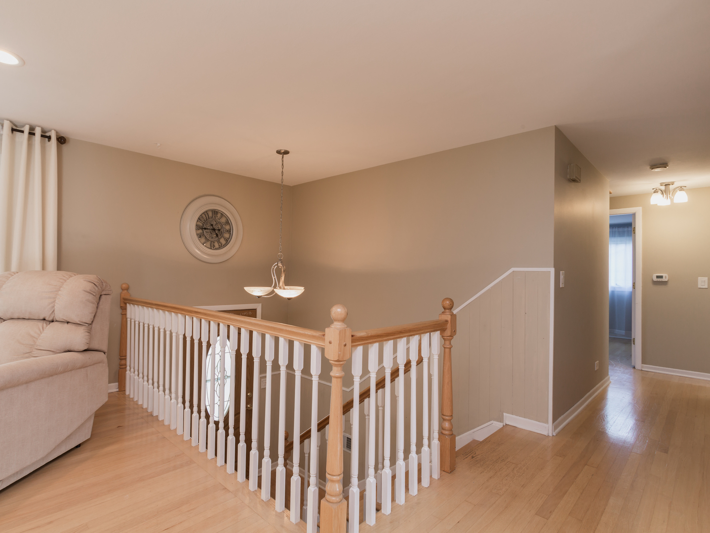 829 Pinehurst Lane Schaumburg, IL 60193 - Photo 11 of 45 a view of a livingroom with a staircase