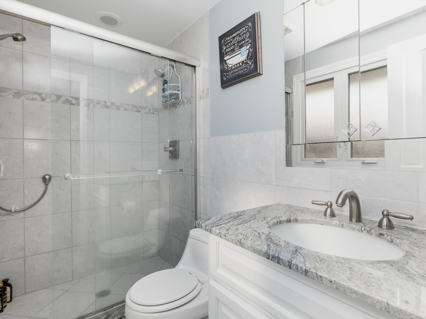 829 Pinehurst Lane Schaumburg, IL 60193 - Photo 18 of 45 a bathroom with a granite countertop sink toilet and shower