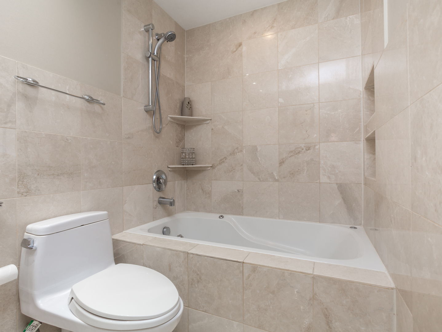 829 Pinehurst Lane Schaumburg, IL 60193 - Photo 29 of 45 a white toilet sitting next to a bath tub and a shower