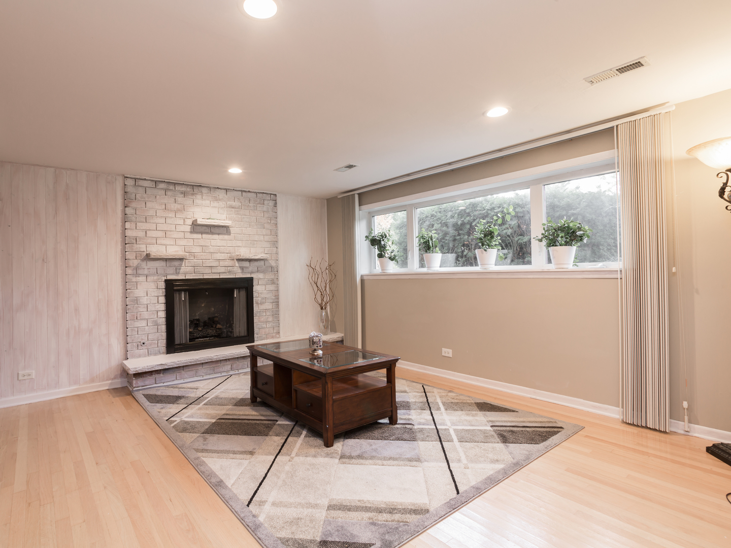 829 Pinehurst Lane Schaumburg, IL 60193 - Photo 33 of 45 a living room with furniture and a fireplace