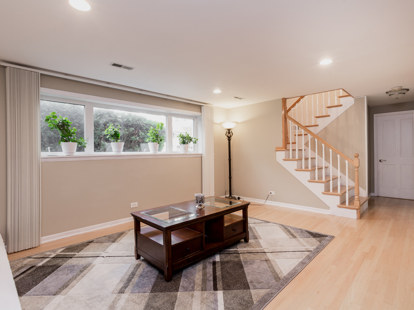 829 Pinehurst Lane Schaumburg, IL 60193 - Photo 35 of 45 a living room with furniture and a window