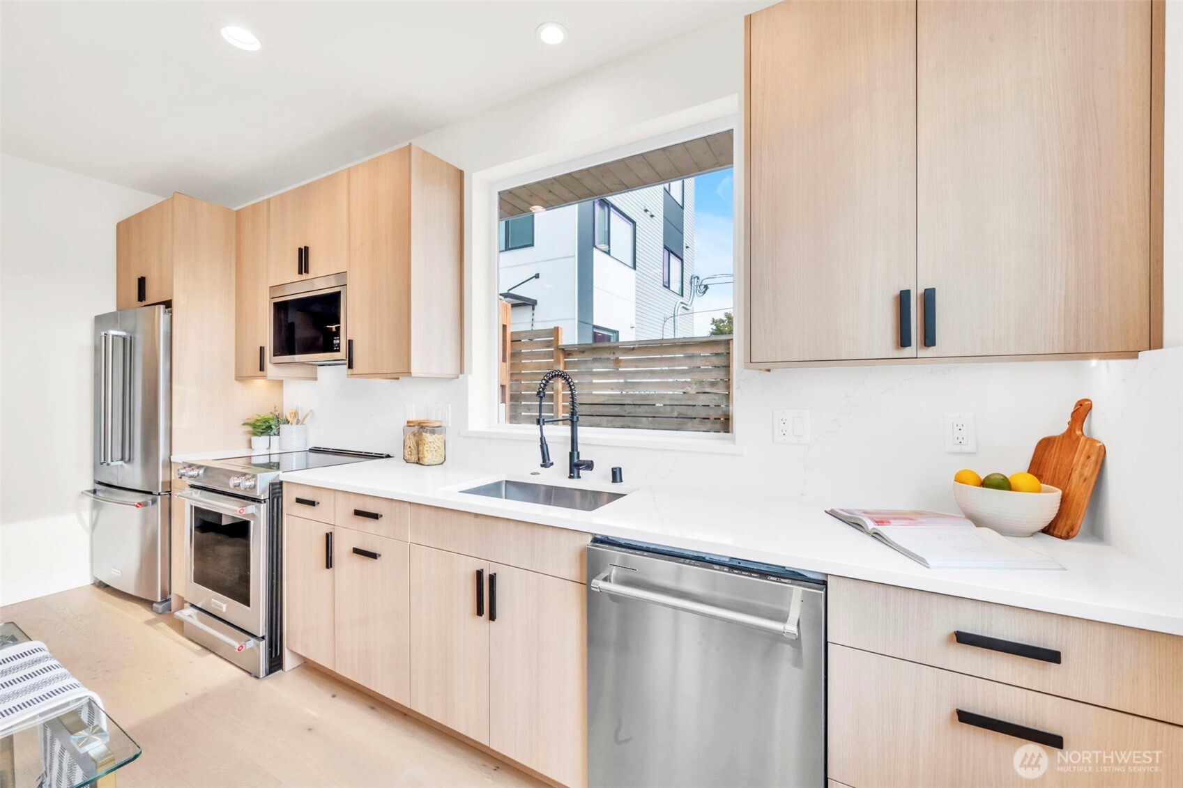 6408 Fauntleroy Way Southwest Seattle, WA 98136 - Photo 11 of 40 a kitchen with a sink stove and refrigerator