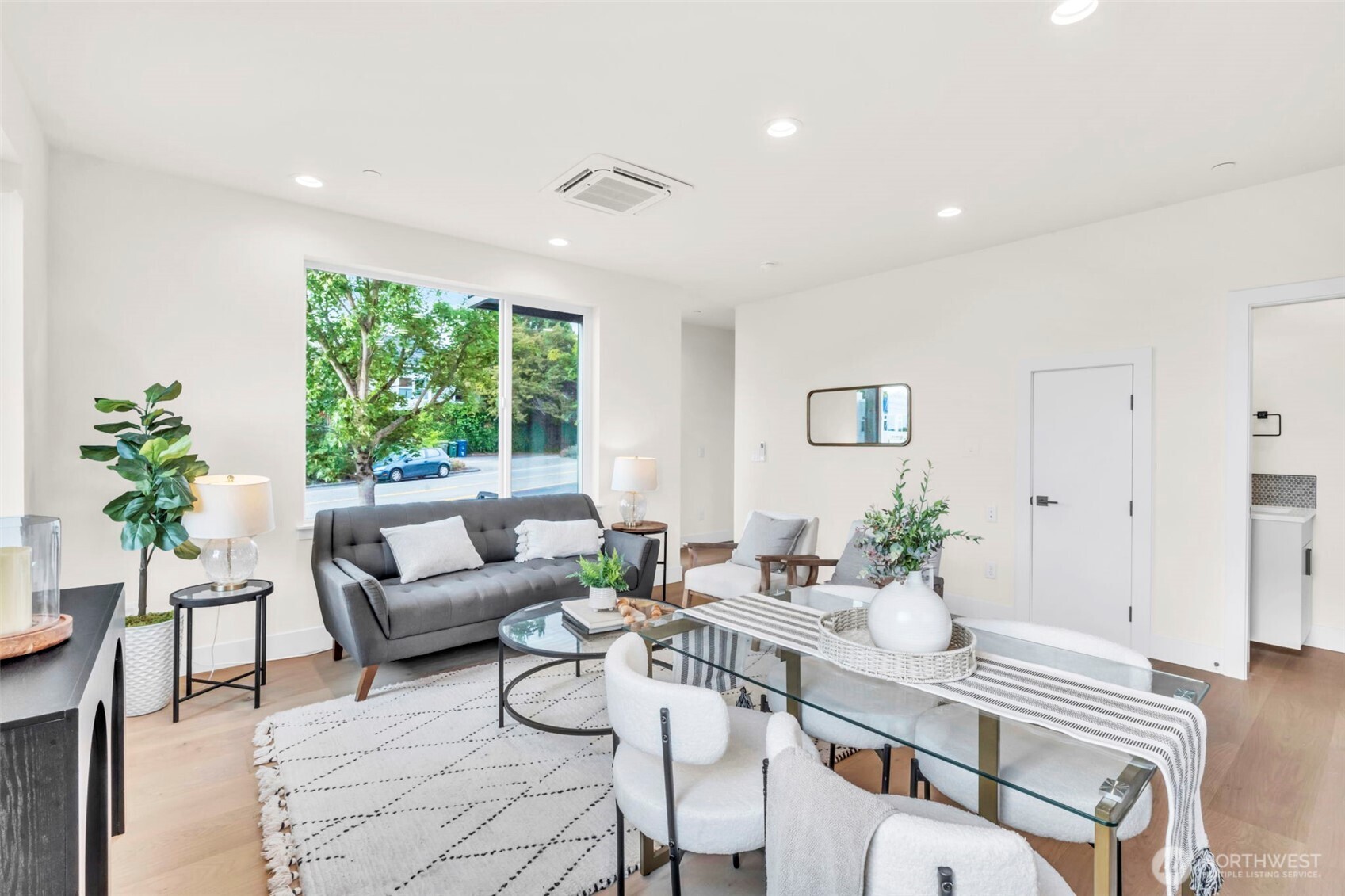 6408 Fauntleroy Way Southwest Seattle, WA 98136 - Photo 13 of 40 a living room with furniture and a large window