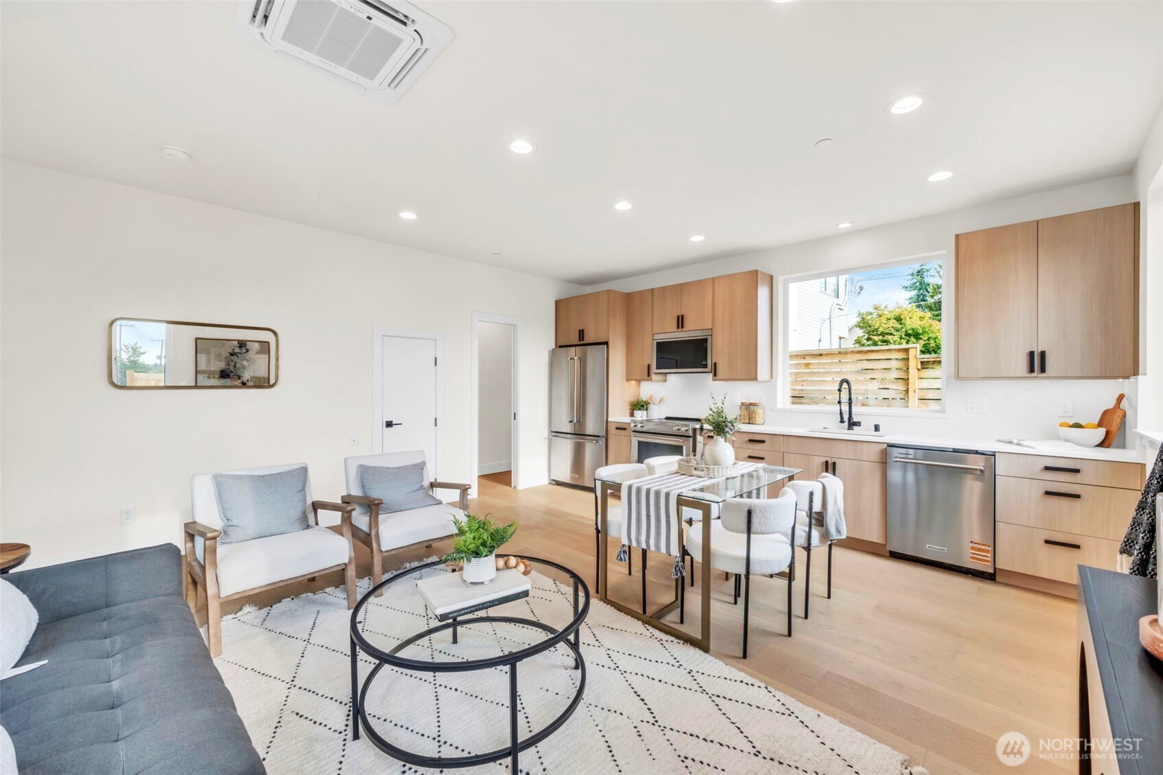 6408 Fauntleroy Way Southwest Seattle, WA 98136 - Photo 14 of 40 a living room with furniture a dining table and kitchen view
