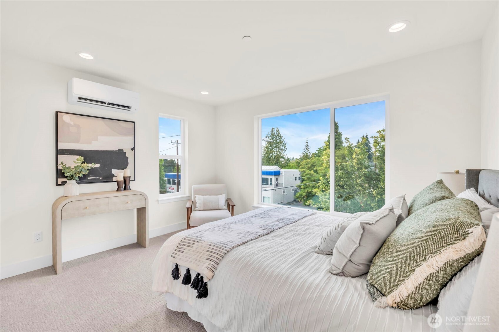 6408 Fauntleroy Way Southwest Seattle, WA 98136 - Photo 16 of 40 a bedroom with a large bed and a large window