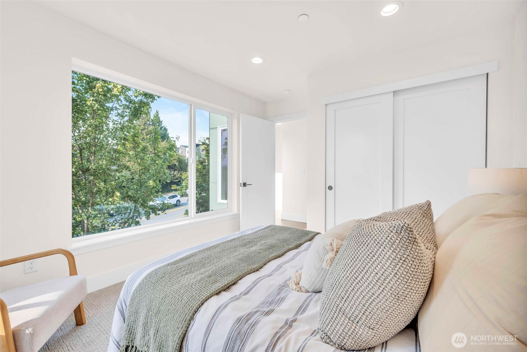 6408 Fauntleroy Way Southwest Seattle, WA 98136 - Photo 21 of 40 a bed sitting in a bedroom next to a window