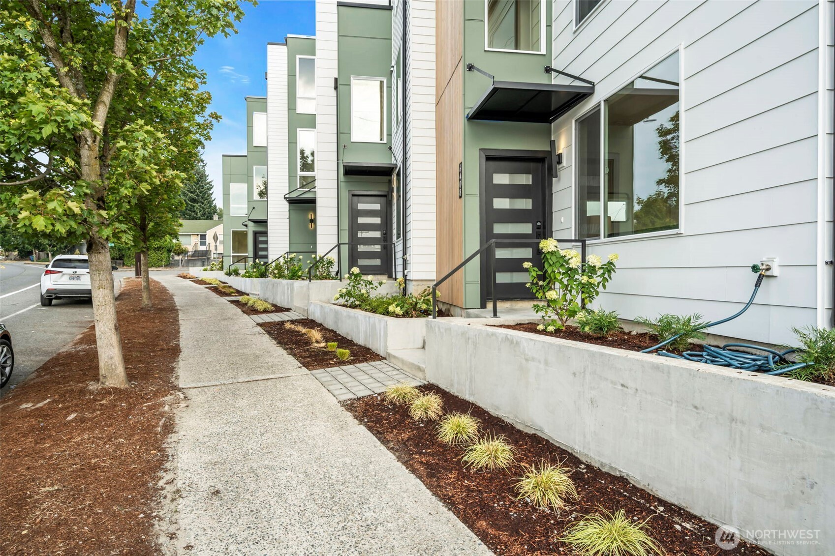6408 Fauntleroy Way Southwest Seattle, WA 98136 - Photo 7 of 40 a view of a building with potted plants